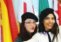 image of Rio Salado staff taking a selfie in front of flag display