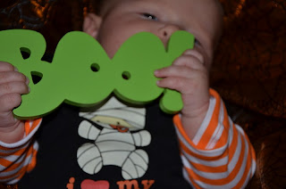 Baby with a boo sign