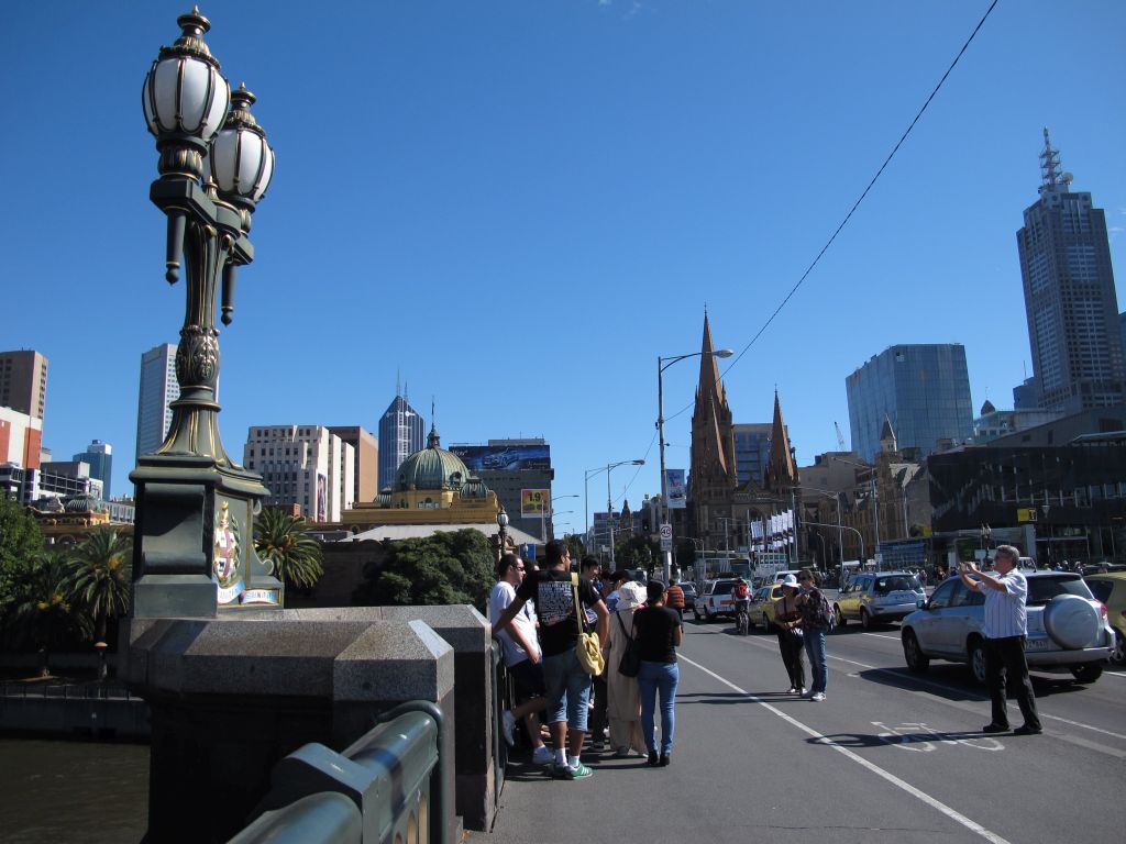 Taking photos on Princes Bridge, Melbourne Taking photos on Princes Bridge, Melbourne. Photo by Susan Wellington