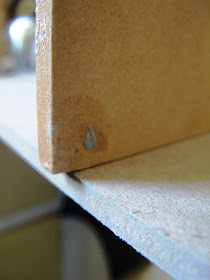 One piece of MDF, perpendicular to another, with a small amount of overhang.