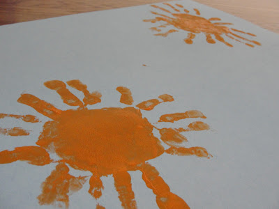 child's handprint sun