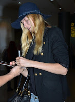 Very easy, but it's casual fashion trend as the Supermodel, Bridget Malcolm, 23, appeared wearing a navy jeans, worn with a huge hat, and stuffed a dark blazer at the airport in Sydney, Australia on Sunday, December 20, 2015.