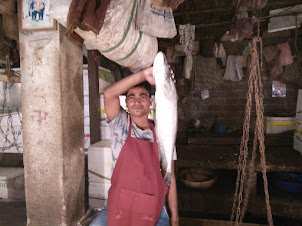 A local fish seller in "Paltan Bazaar Fish Market"