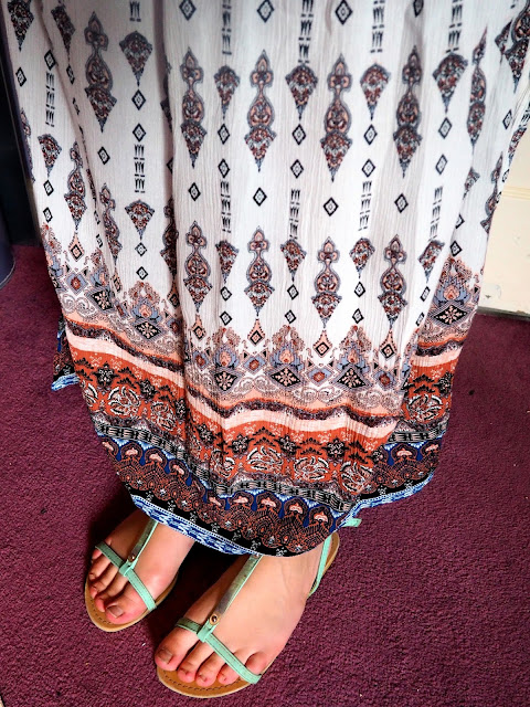 Ethereal | outfit details of patterned maxi skirt and green strappy sandals