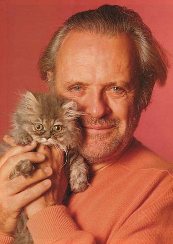 men holding cats, men wearing cats
