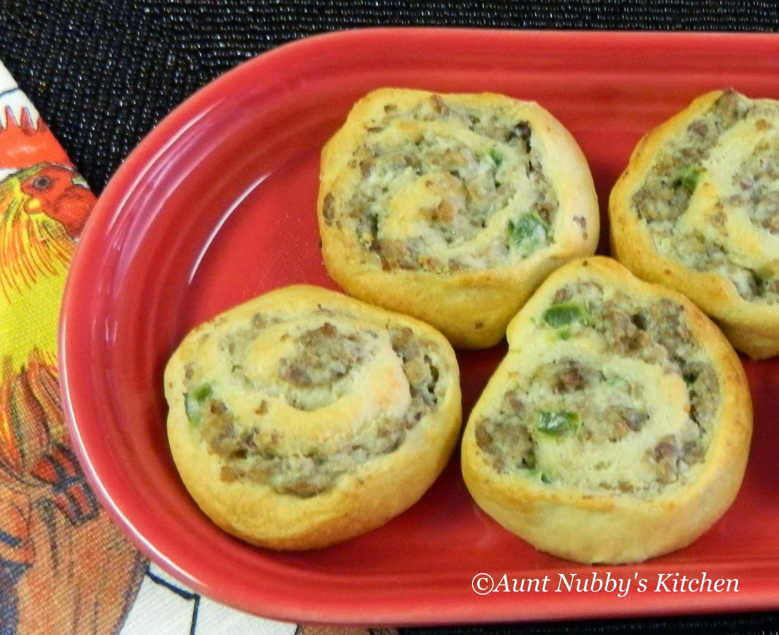 Sugar Spice and Spilled Milk Cream Cheese Jalapeño Sausage Pinwheels