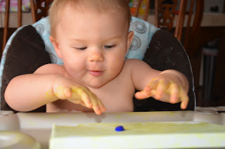 baby painting on canvas