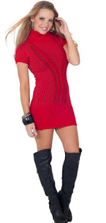 girl wearing boots and red cowl neck sweater dress