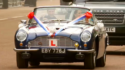 The newlyweds drive off as Learners in an Aston Martin. YouTube 2011.