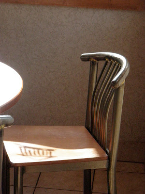 chair with greek temple shadow on seat
