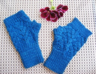 http://buttonsandbeeswax.com/patterns/mitts-and-gloves/nordic-lace-mittens-knitting-pattern/