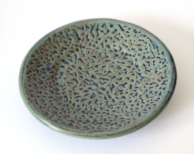 carved and glazed pottery plate