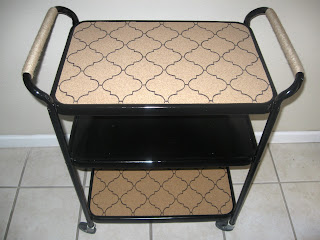 Black painted rolling cart with stenciled cork trays