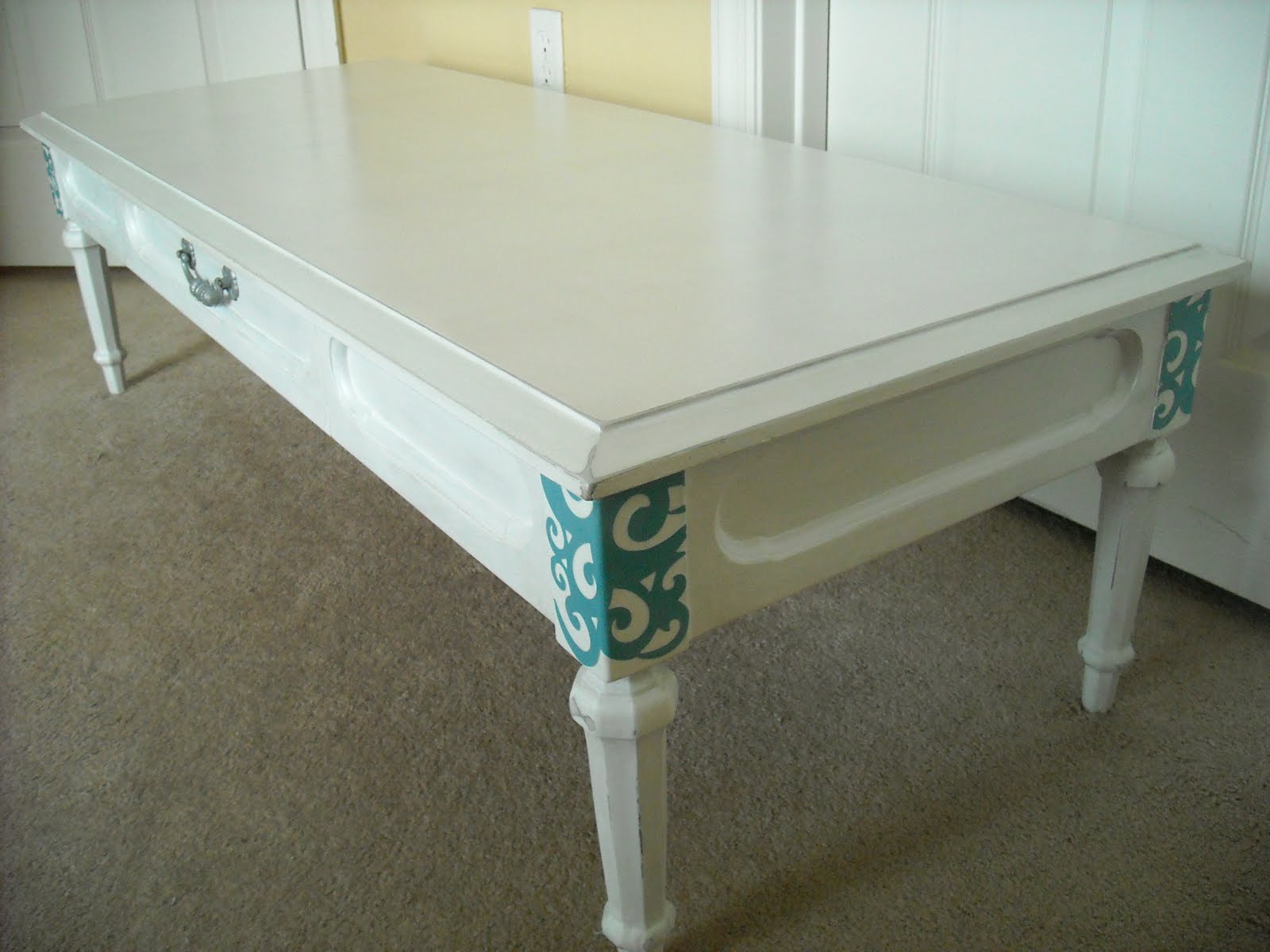 The Maison Studios White Distressed Coffee Table with Turquoise Accents