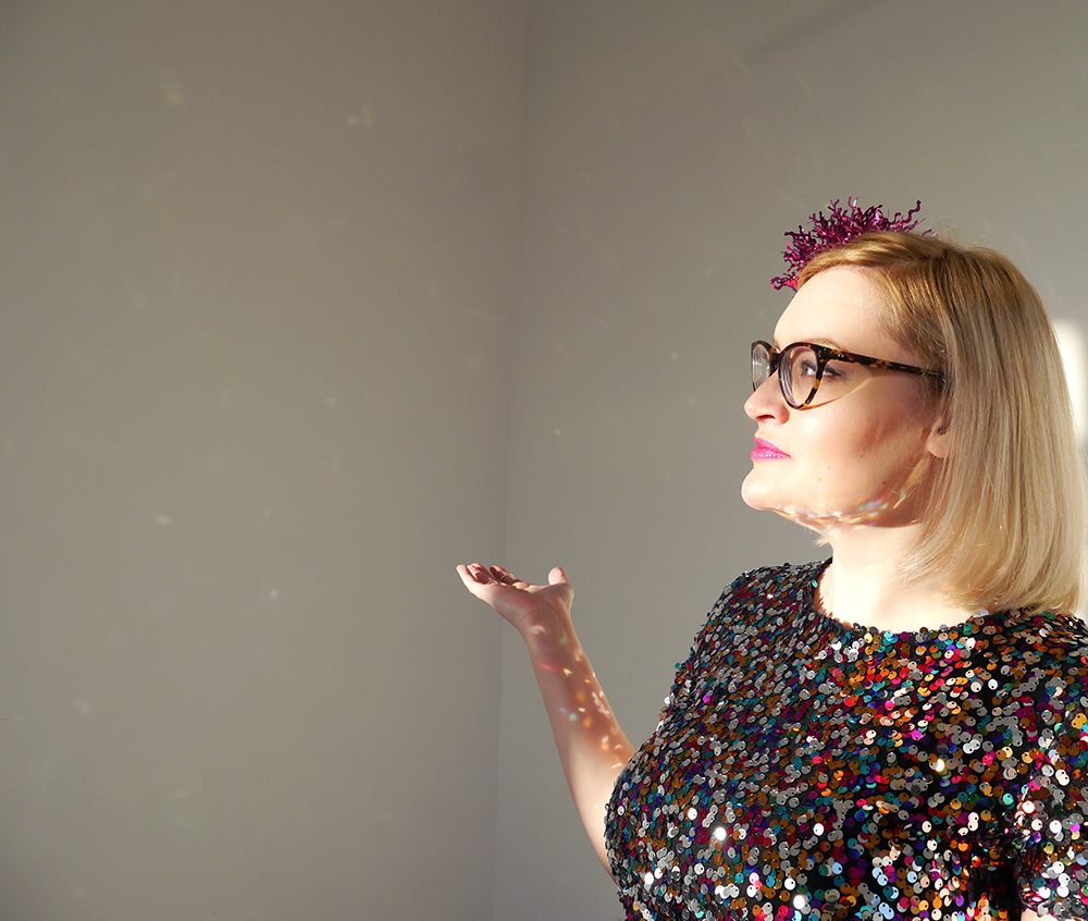 Glitter ball style for New Years Eve, as styled by Wardrobe Conversations sequins, sparkly New Year outfit, how to wear sequins, glitter ball outfit, Christmas party, ballerina skirt, IOLLA Muir glasses, tinsel hair clip
