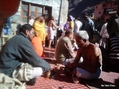 Person performing puja in Badrinath