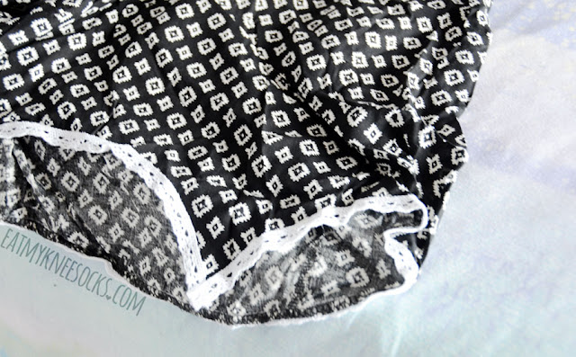 Wholesalebuying Fashion Review: Printed Cutout Romper This romper from Wholesalebuying features an allover geometric print, tie-back halter neckline, asymmetric hem, hidden zipper, and side cutouts with a thin crochet trim.