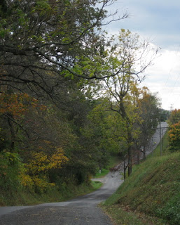 Rolling rural road with changing leaves in Virginia