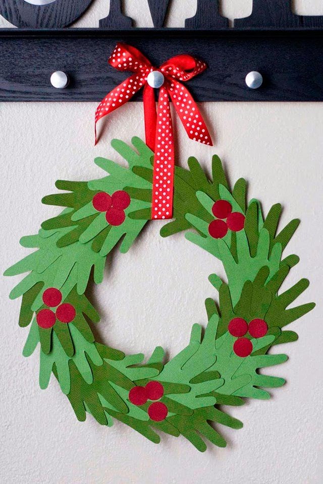 Make this adorable (and inexpensive) Christmas Hand Print Wreath with your kids! It's sure to be your most valuable Christmas decoration! | My Name Is Snickerdoodle 