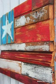 Patriotism reigns with a reclaimed wood flag by Beyond the Picket Fence, featured on ILoveThatJunk.com