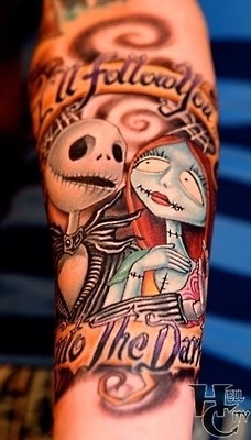 Jack ink and barbie doll tattoo on arm