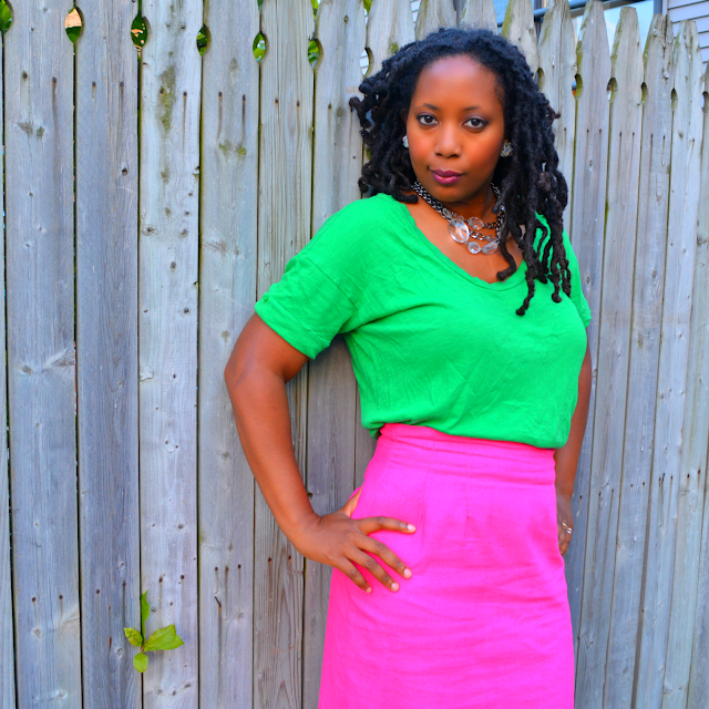 green tee worn with pink pencil skirt