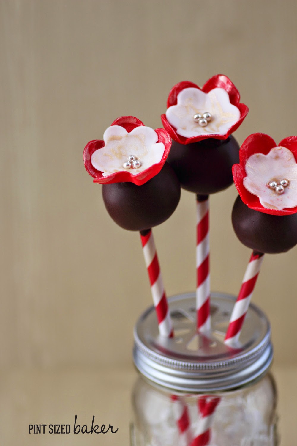 Sweet Flowers Cake Pops 3 I'm loving these easy cake pops with pretty fondant flowers! My daughter would love them!