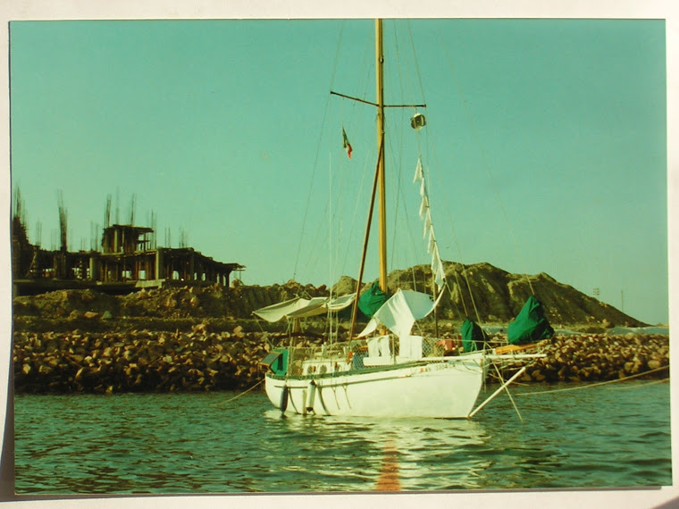 Anchored near Puerto Vallarta, Mexico.  Diapers drying on halyard.  "Baby burgees"