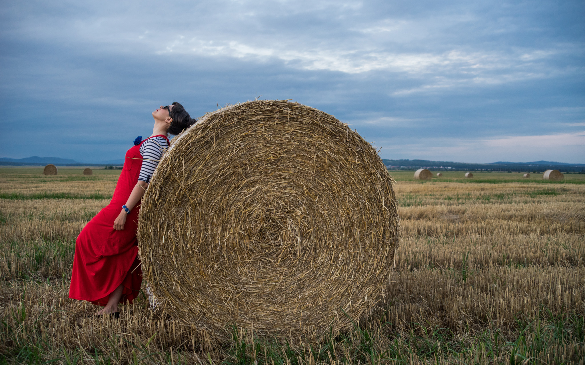 maxi red dress striped top stripes pimkie black flats cardigan hay bales photo shooting  black maxi bag brasov trip mountains 