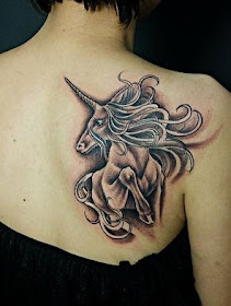  a unicorn on a girl's back