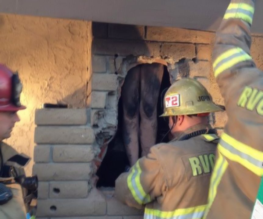 Naked woman stuck in chimney