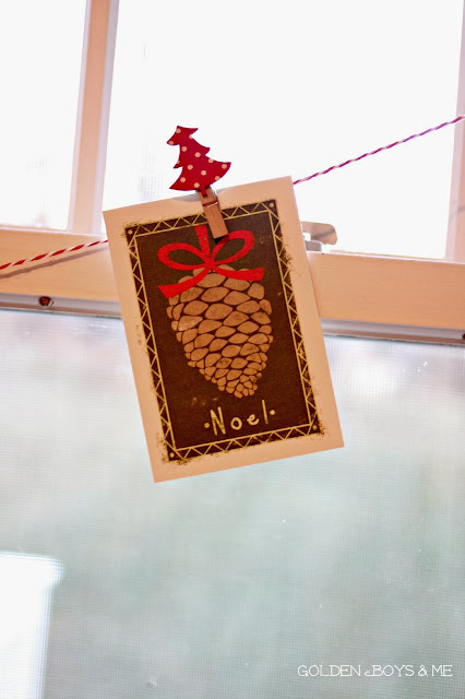 Christmas card garland from baker's twine in kitchen-www.goldenboysandme.com