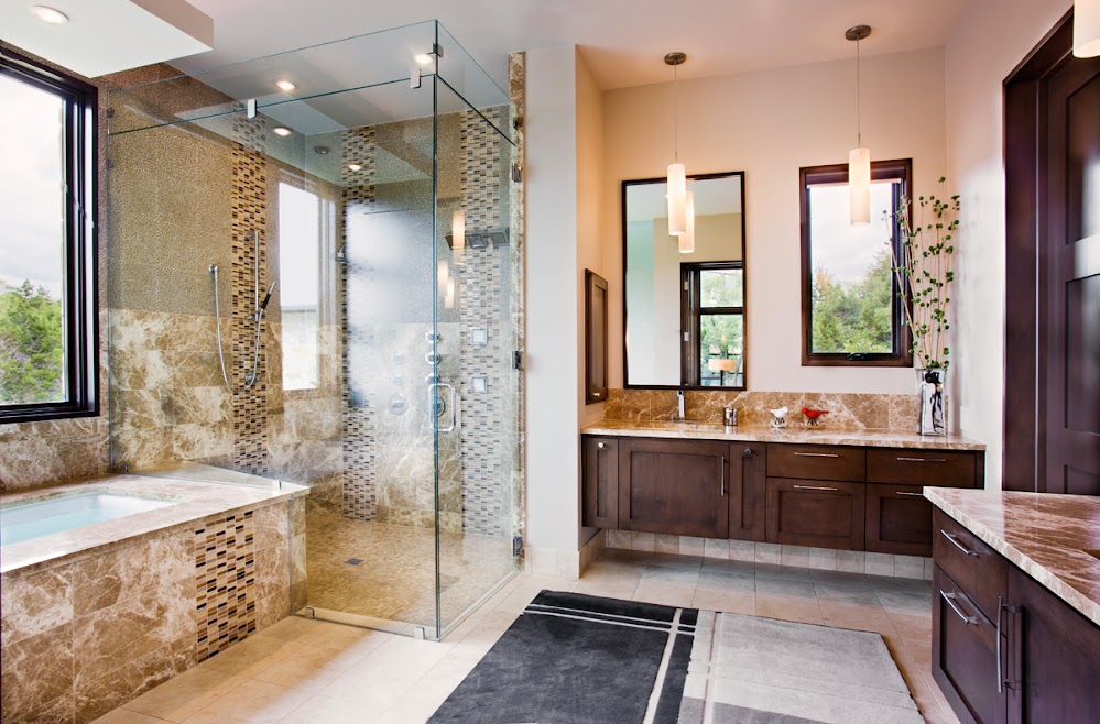 Photo of big modern bathroom with glassy shower cabin
