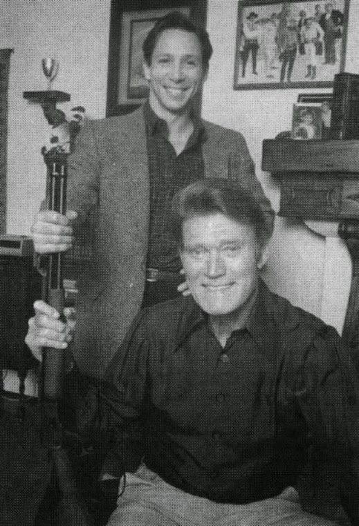 Chuck Connors and old Rifleman co-star, Johnny Crawford pose for picture at Chuck's home. 1983.