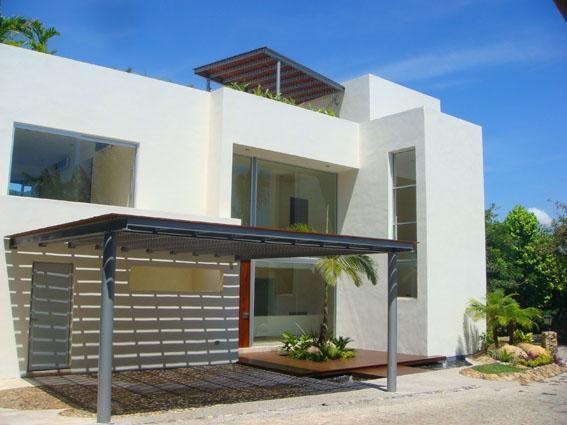 Fachadas Minimalistas: Fachada de casa minimalista con cochera techada