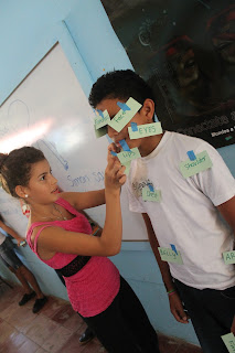Hellen placing labels on her teammate, Steven.