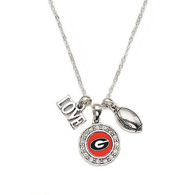 Go Bulldogs! This item is crafted from white metal with a sterling overlay. The necklace includes a University of Georgia pendant, football and a love charm. This necklace includes a complimentary chain that measures 18 inches long and is complete with a secure lobster claw clasp. This item is made in the USA and is licensed by the university. The total carat weight is 1/2 a carat.