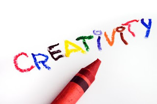 The word creativity written in crayons
