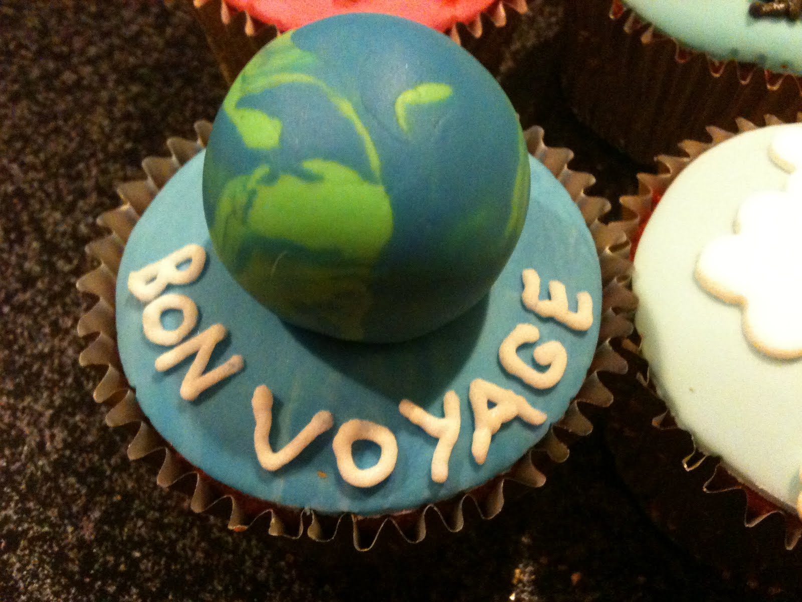scrumptious homemade travel themed cupcakes