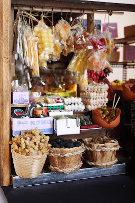 Detail of the front of a modern dolls' house miniature Hong Kong grocery shop.