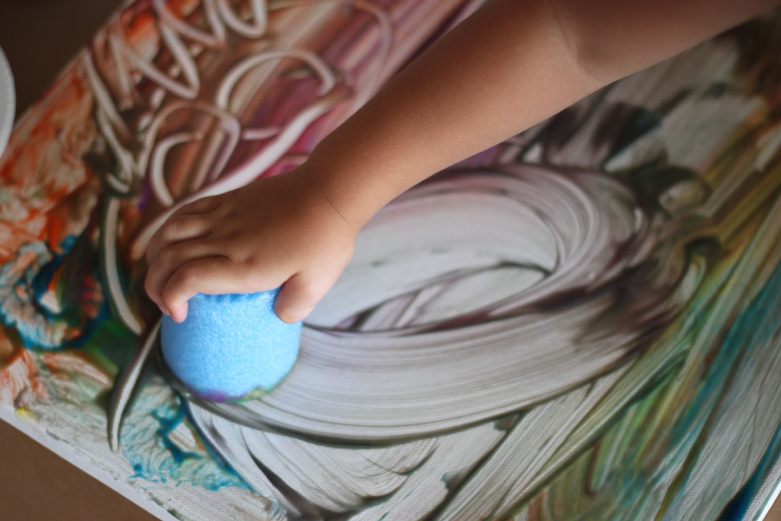 Playing House Finger Painting on a Canvas