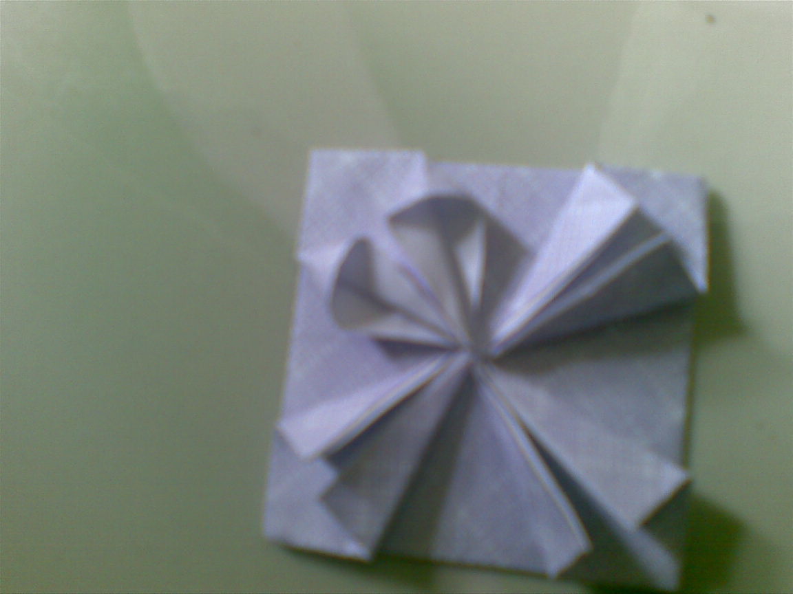 Cara membuat bentuk bunga menggunakan kertas origami