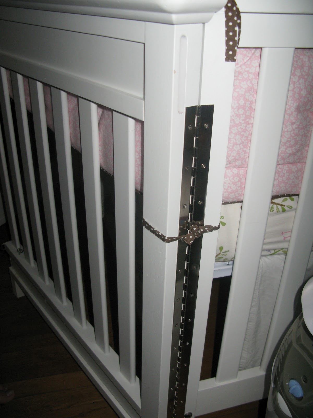 crib with swing door