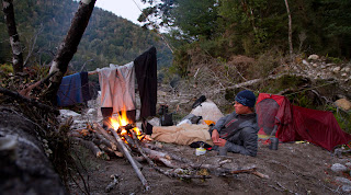 Trying waders on the campfire