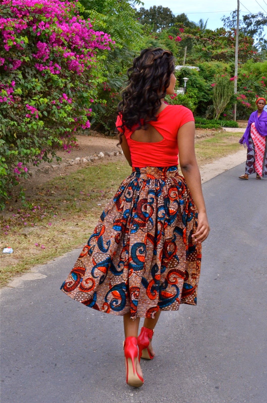 Kiki's Fashion Crop top and African print flared skirt available at Kiki's Fashion Boutique