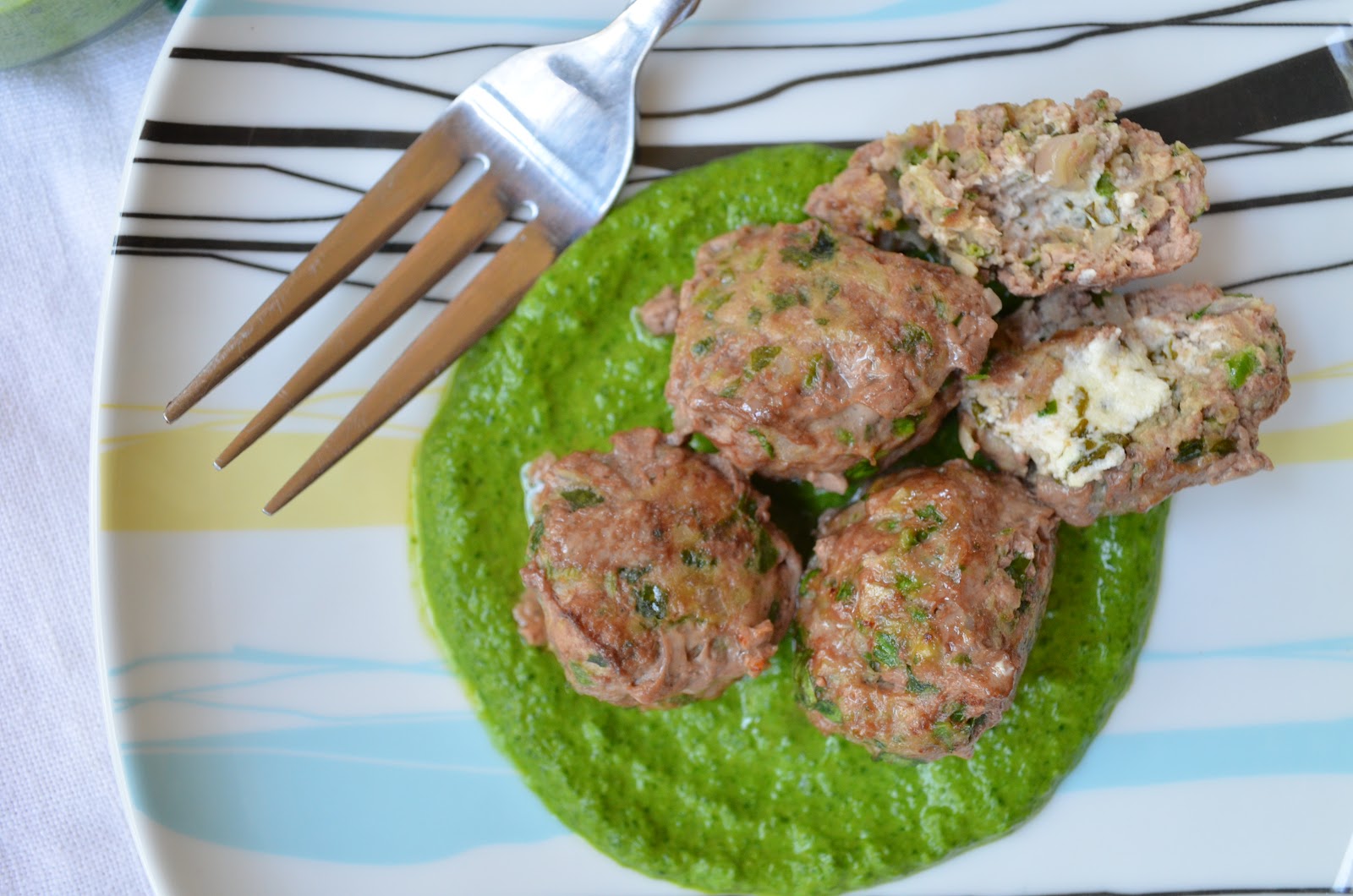 iron stef goat cheese stuffed lamb balls with spinach cumin pesto
