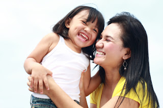 Photo of Mom and Daughter enjoying fun interaction together