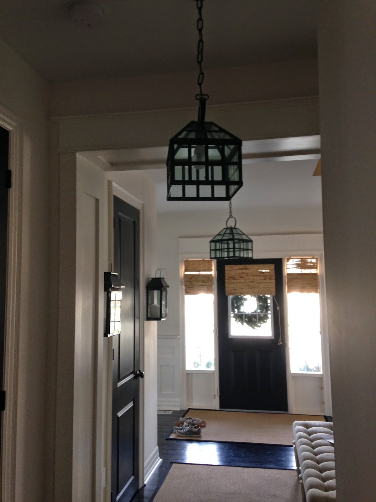 White wood studio: a long journey to find the right foyer light