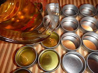 Tulips Apothecary Lip Balm being poured into tins