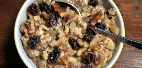 cooked oatmeal with dried plum and walnuts